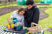 RHS Growing Gardeners potting mat, link-a-pot, scoop, glove and watering can